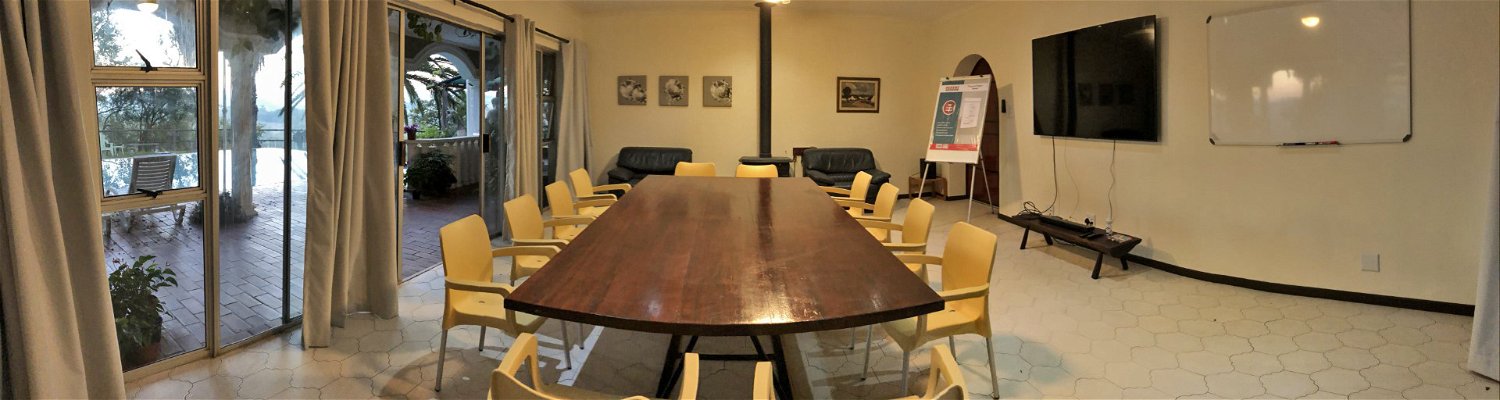Conference room next to Lanseria Airport with Smart TV and HDMI cable, whiteboard and flipchart, blackout curtains, fireplace, fans and aircon.   #self-catering accommodation #Lanseria #Lanseria Airport  #country escape  #accommodation  #Bed and breakfast 