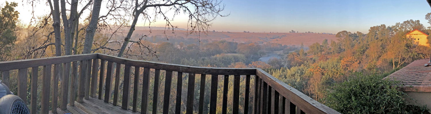 Starling deck at Hills and Dales Accommodation.  Spacious family unit close to Lanseria Airport in the countryside, overlooking a lovely view of the river and hills.