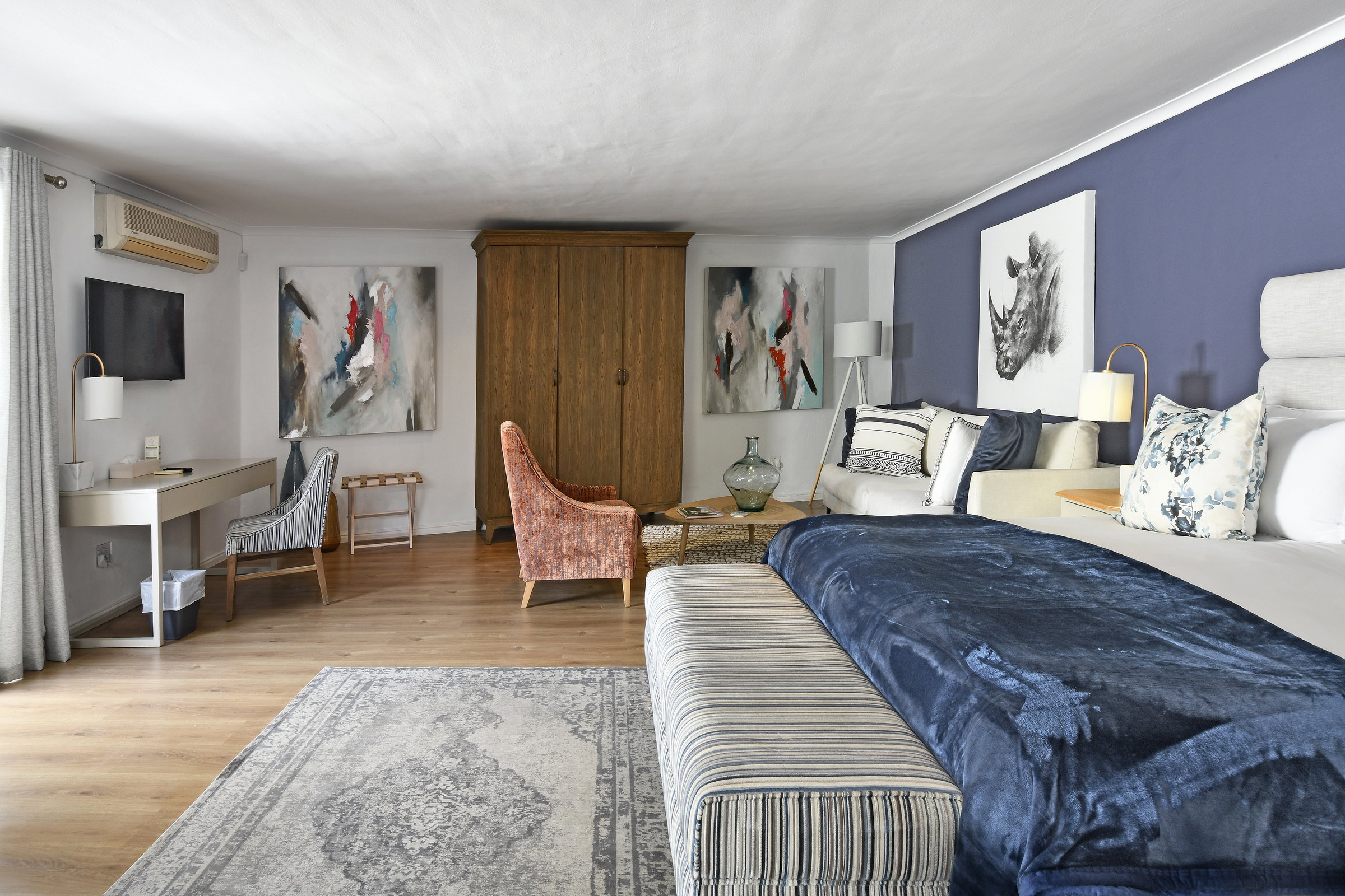 Luxury ensuite bedroom with king-size bed and private patio at our Franschhoek guesthouse 