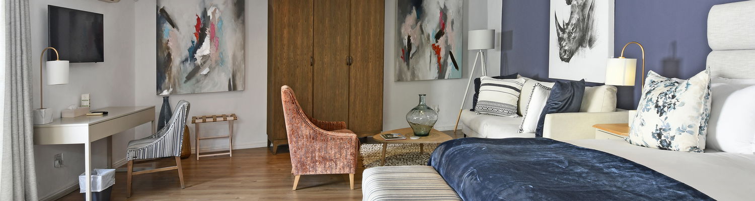 Luxury ensuite bedroom with king-size bed and private patio at our Franschhoek guesthouse 