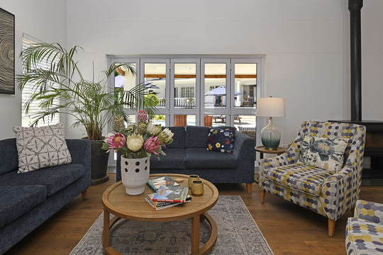 Stylish indoor lounge overlooking the swimming pool in Franschhoek