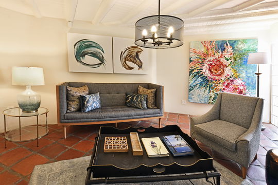 Cozy guest lounge with fireplace and book exchange in Franschhoek Valley
