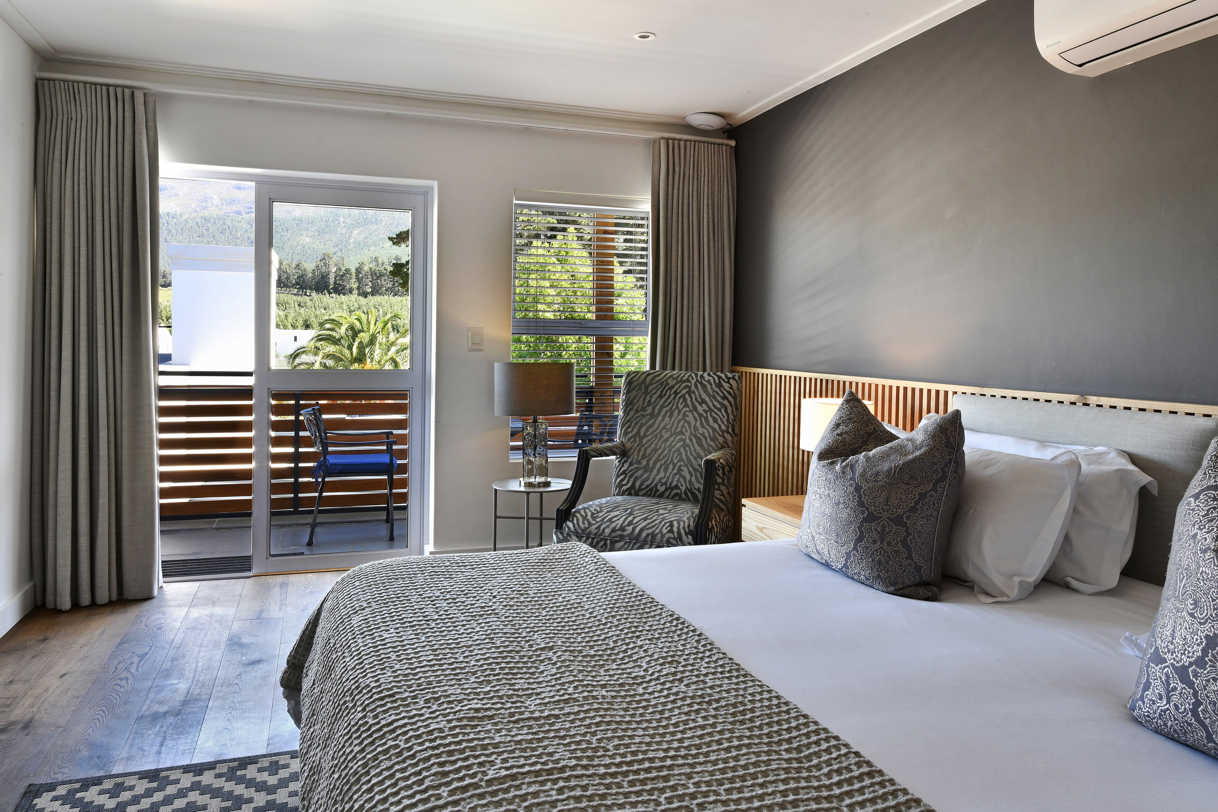 Elegant guestroom with king-size bed and ensuite bathroom at Mirabelle Guesthouse
