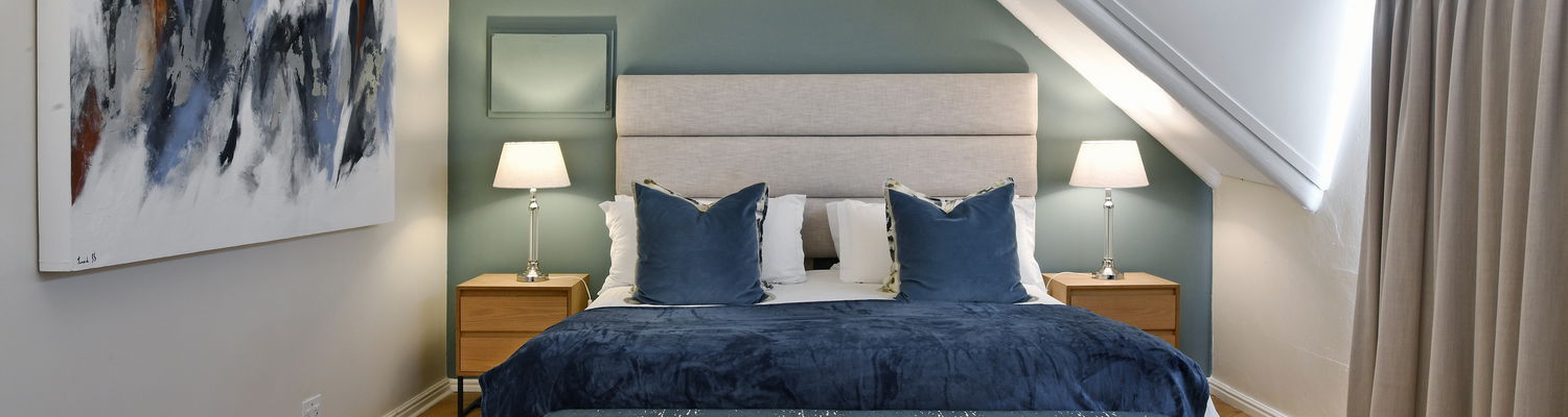 Luxury bedroom at Mirabelle Guesthouse in Franschhoek with ensuite bathroom
