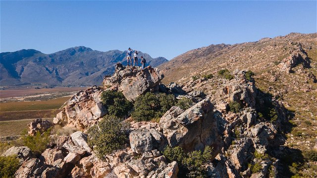 Hikers on top of a koppie at Wolvenberg & Stille Waters campsites.