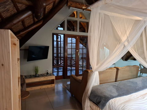 Kruger Riverside Lodge, Marloth Park, DCC Hotel Group, loft suite, mosquito net bed, private balcony, safari lodge comfort, bushveld views