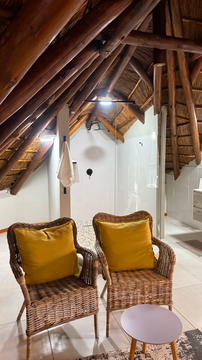 Kruger Riverside Lodge, Marloth Park, DCC Hotel Group, rustic loft, thatched ceiling, cozy seating, safari retreat, boutique lodge.