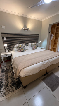 modern lodge design, king-size bed, cozy retreat, stylish bush accommodation, intimate safari stay, comfortable interiors, tranquil getaway