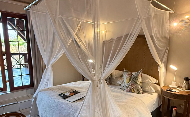 Kruger Riverside Lodge, Marloth Park, DCC Hotel Group, canopy bed, cozy safari bedroom, stylish interiors