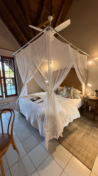 Kruger Riverside Lodge, Marloth Park, DCC Hotel Group, canopy bed, cozy safari bedroom, stylish interiors