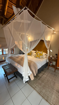 Kruger Riverside Lodge, Marloth Park, DCC Hotel Group, luxury safari suite, four-poster bed, mosquito net canopy