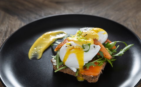 Benedict: Toasted health bread, two soft poached Eggs, Hollandaise sauce, Rocket & Spring Onion 