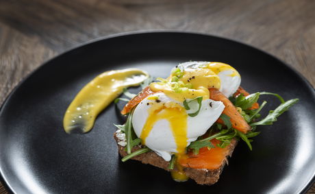 Benedict: Toasted health bread, two soft poached Eggs, Hollandaise sauce, Rocket & Spring Onion 