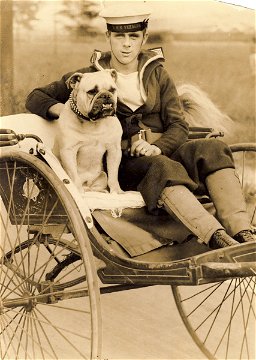 Ship's dog, Bondi, with one of his shipmates off HMS Verbena