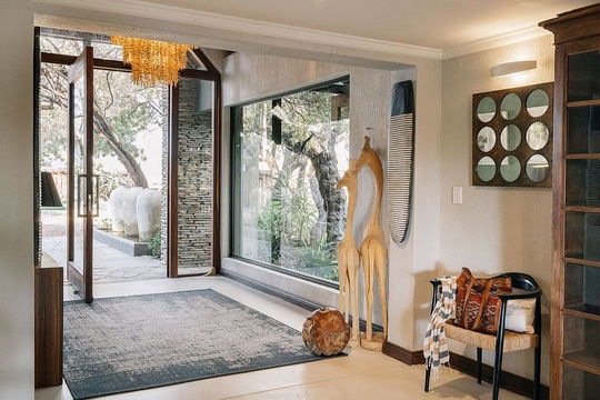 Simbavati Amani Lodge offers elegantly designed interiors with spacious, light-filled living areas that blend comfort and style.