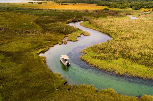 Kosi Forest Lodge iSimangaliso Wetland Park, KwaZulu-Natal. Boat Safaris on the Kosi River. DCC Hotel Group Collection.
