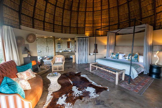 Relax in nature’s beauty with modern comfort at Gondwana Game Reserve. Enjoy cozy couches, a plush bed, and stylish interiors that create the perfect retreat.