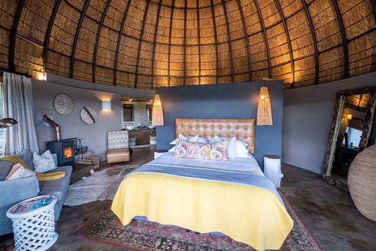 Experience the luxury of comfort and nature at Gondwana Game Reserve, where cozy bedrooms with stylish furniture and plush bedding offer the perfect retreat in a stunning setting.