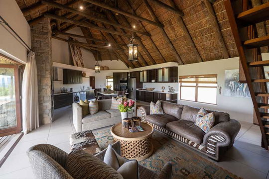 Experience ultimate relaxation in the living room at Gondwana Game Reserve, where stunning interiors and cozy furnishings create the perfect spot to unwind and connect with nature after a day of adventure.