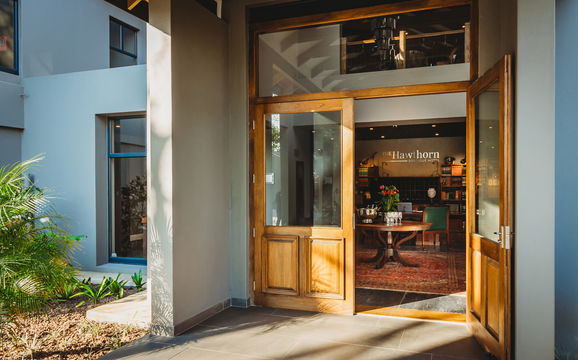 Experience the charm of Hawthorn Boutique, where modern design meets cozy comfort. Enter through the welcoming glass door and enjoy a home that offers both style and relaxation.