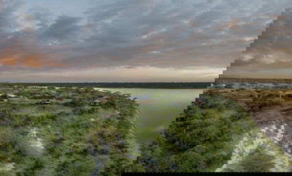 Experience the tranquil beauty of Simbavati Lake Ndutu, where the calm waters and stunning surroundings offer a serene escape in the heart of Serengeti National Park.
