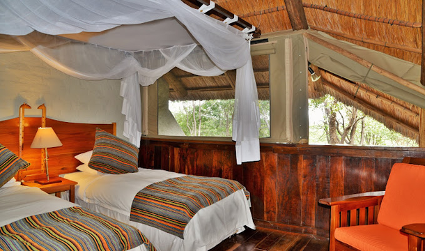 Relax in exquisite accommodations at Victoria Falls Safari Club, where every detail, from the bedding to the lighting, promises an unforgettable stay.
