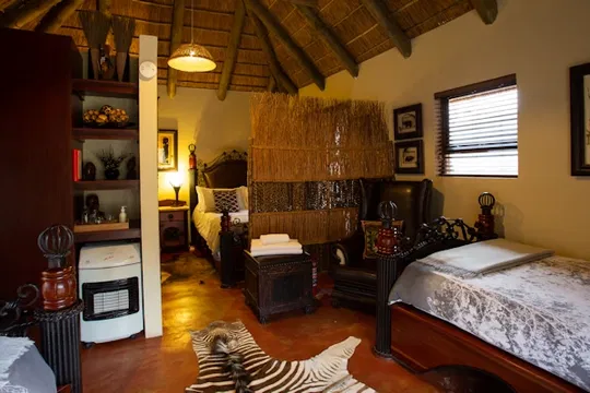 Experience comfort at Indalu Game Reserve, where thoughtfully designed bedrooms blend soft linens, ambient lighting, and elegant furnishings for ultimate relaxation.