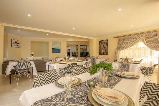 Relax in elegance at Royal Hills Lodge and Spa! Enjoy a memorable meal in our beautifully designed dining room, where chic white tables and chairs surround you with sophisticated decor.