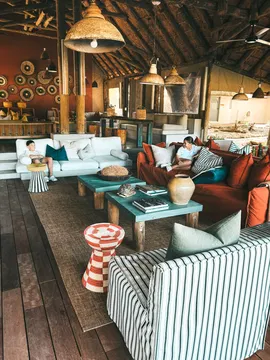 Enjoy a warm and cosy setting at Simbavati River Lodge, where picturesque surroundings and comfortable seating combine to create a peaceful sanctuary.