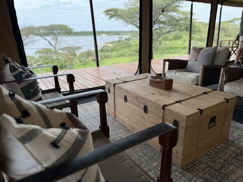 Unwind in an indoor space where distinctive decor and natural light create a tranquil environment, complemented by views of the surrounding landscape.
