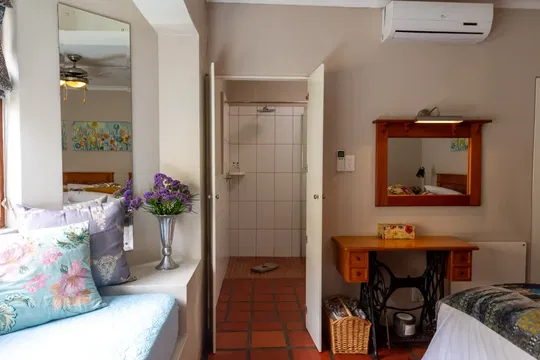 Discover the tranquility of Skeiding Guest Farm, where cozy bedding and elegant design create a peaceful haven for relaxation after your outdoor adventures.