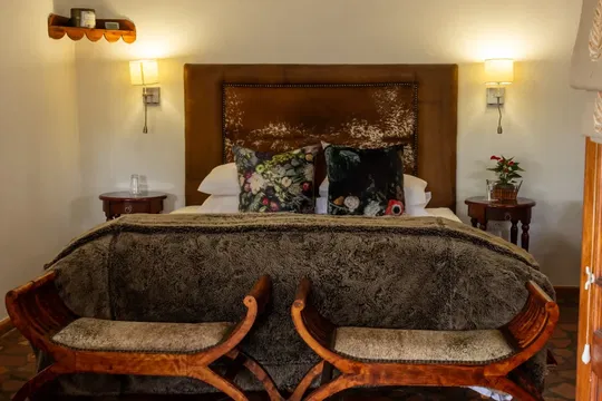 Experience the tranquility of Skeiding Guest Farm, where each room is designed to offer comfort and style, perfect for relaxing after exploring the stunning surroundings.