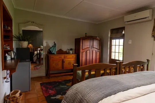 Experience the cozy charm of Skeiding Guest Farm, where spacious rooms with comfortable beds and elegant decor create the perfect place to unwind and relax.