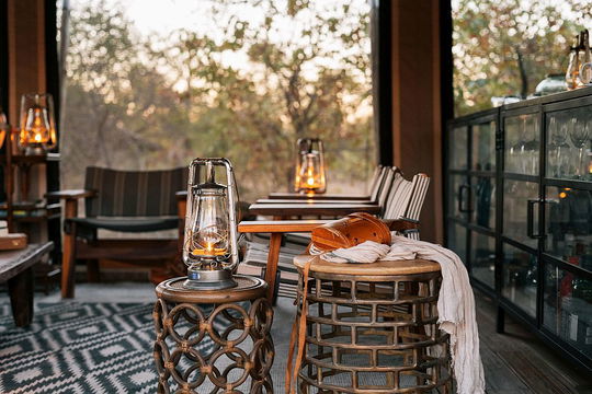Relax in the inviting bar space at Simbavati Trails Camp, where comfortable seating and a tranquil environment set the perfect mood for unwinding and enjoying drinks.