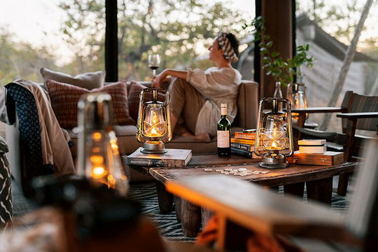 A tranquil space where comfort, good wine, and warm ambiance come together for a peaceful escape.