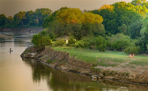 people chilling on the riverbank @msandileriverlodge