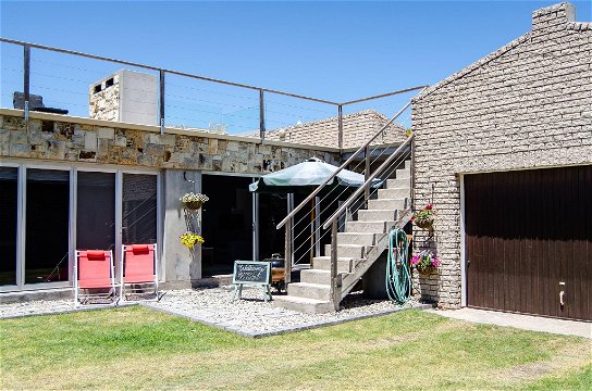 Steps to braai deck above Water's Edge 1