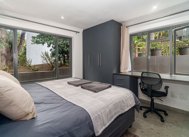Room 7 is furnished with a king-size bed and has a bathroom fitted with a shower. Room 7 is furnished with a king-size bed and has a bathroom fitted with a shower.