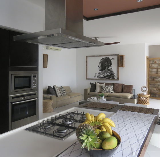 The open-plan layout of the kitchen and living area, creates the ideal space for both cooking and entertainment.