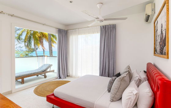 Imani Penthouse - Bedroom 1 - Both bedrooms open onto a sea-facing terrace with breathtaking views of the ocean.