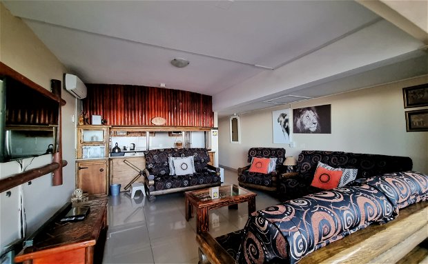 Apartment 101 is our African themed- double story 10 sleeper unit. Its downstairs balcony is closed up creating a lovely viewing station with a built-in bar and stools for your luxury.