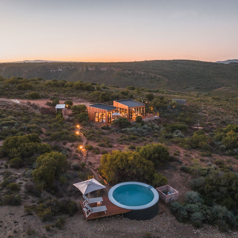 The Mountain House light up during sunset with panoramic views of the mountains