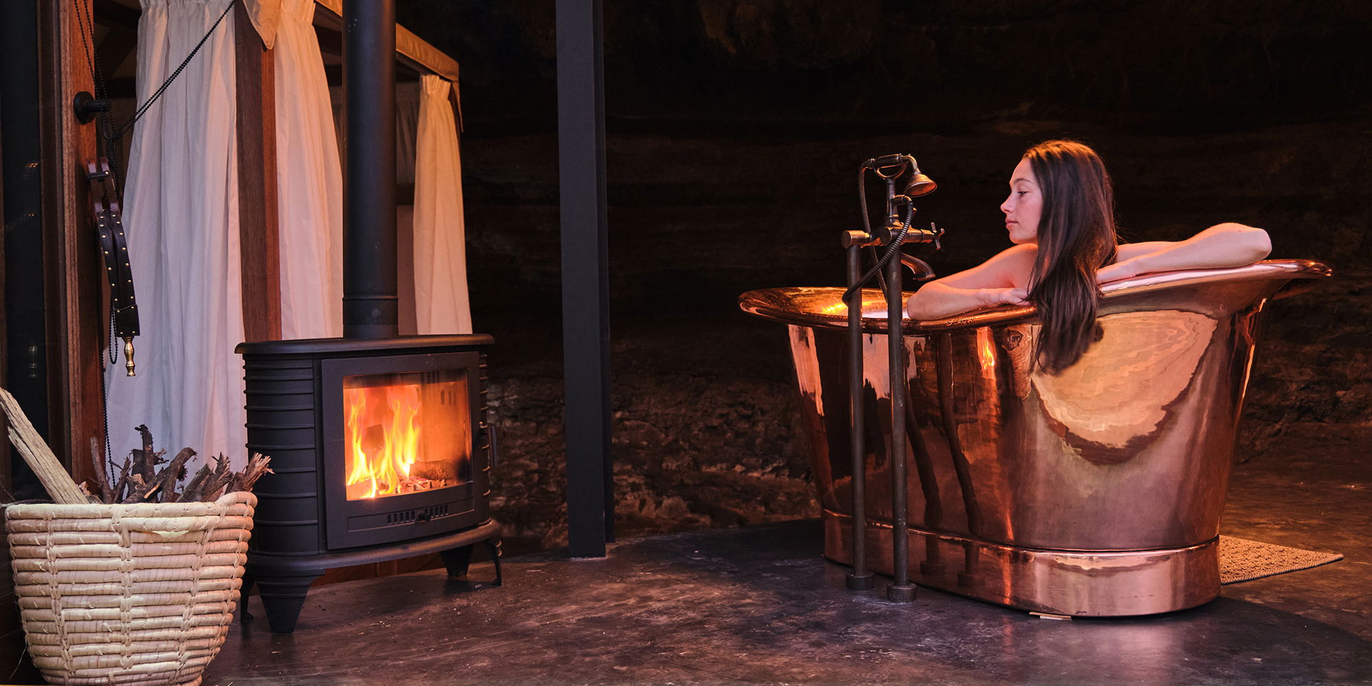 Cave House - Copper bath and indoor fire