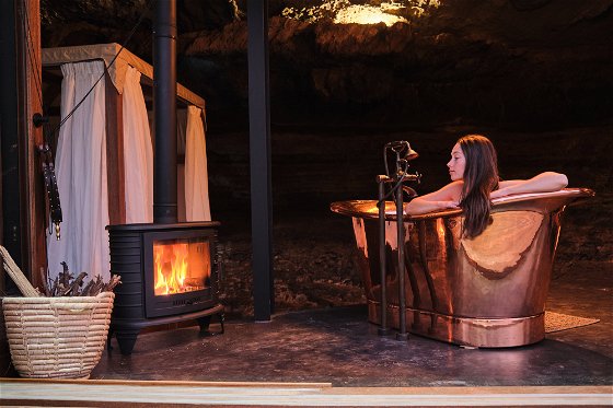 Cave House - Copper bath and indoor fire