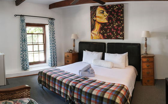 Standard room with king bed or two single beds (adults only, no pets).