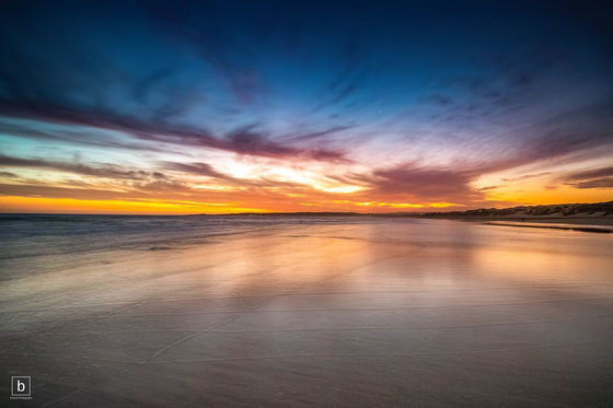 Sun setting over Stilbaai beach