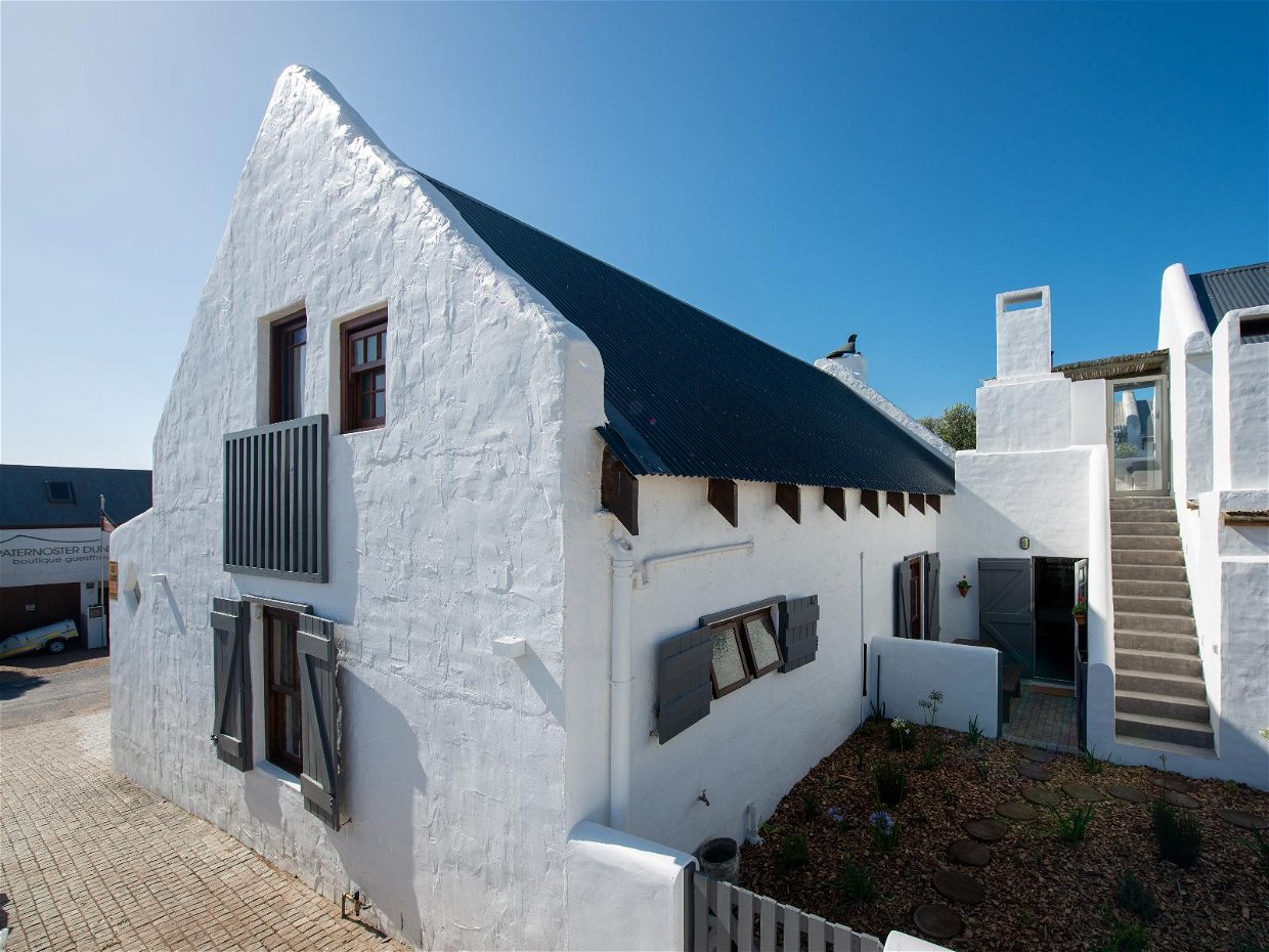 View from the side of Coral Villa, showing the back garden via the kitchen door. 