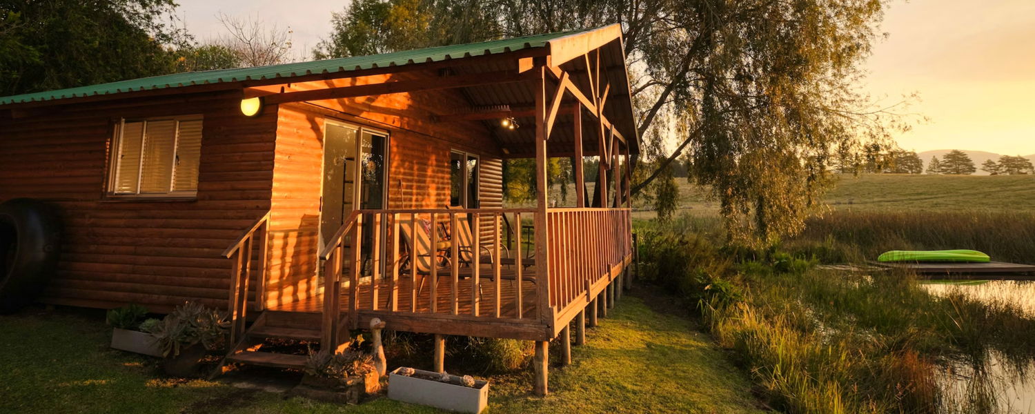 Pet-friendly accommodation in Dargle, KwaZulu-Natal Midlands. Dam-front self-catering cabin for two, small to medium dogs welcome by arrangement. Walking trails, trout dam, no resident dog interaction, ideal for calm, well-managed pets.