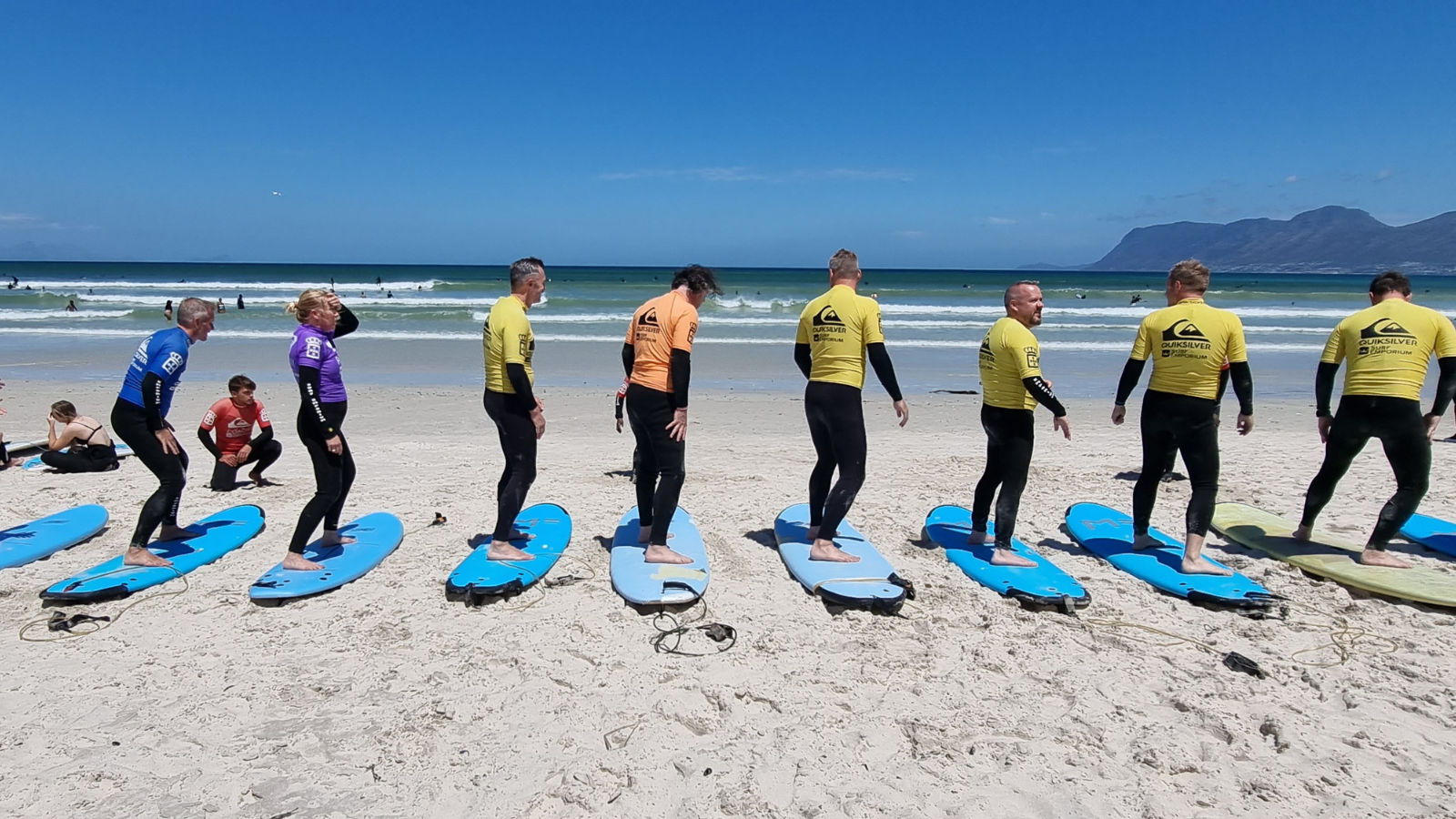 Image showing Gonana Travel Swedish guests learning to surf in Muizenberg on Cape Town Tour