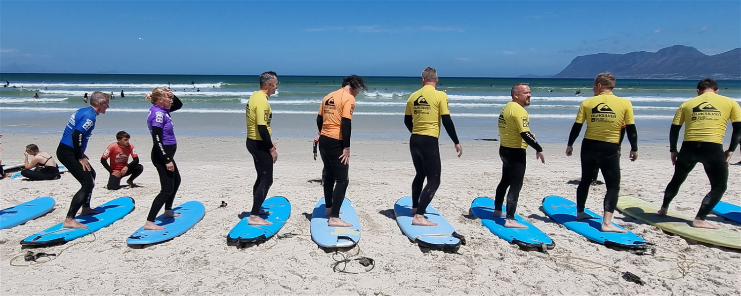 Image showing Gonana Travel Swedish guests learning to surf in Muizenberg on Cape Town Tour